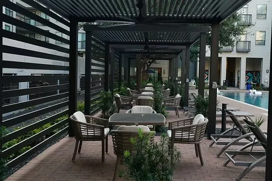 Slatted dining cabana for poolside entertaining